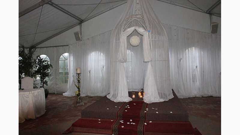 From Wedding 5, Wedding DJ, DJ Oshawa, Beautiful set up in large tent veils draped everywhere, what looks like a very large bird cage extends the full height of the tent draped in veils with several lit candle in the middle. Absolutely beautiful. Taken in Oshawa Ontario